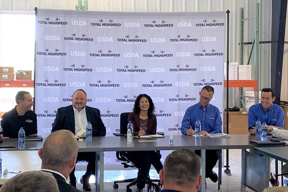 Xochitl Torres Small, center, the USDA's under secretary for rural development, participates in a roundtable discussion Aug. 15 at Total Highspeed in Nixa.
